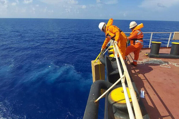 Crewmembers deploying float