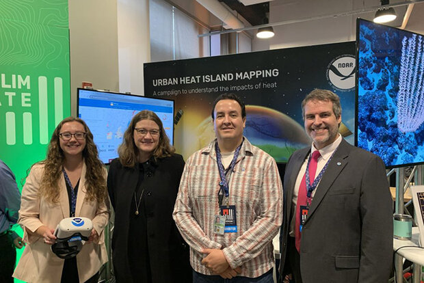 Researchers with exhibit