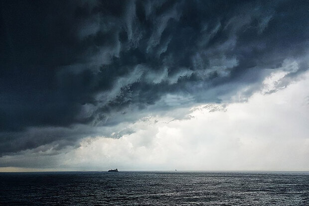 Thunderstorm clouds over ocean