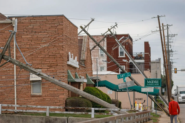 Person walking past downed power lines