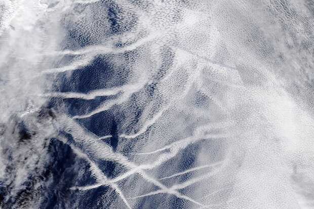 Clouds and exhaust tracks