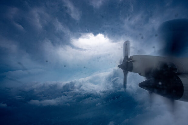 Airplane propellers against backdrop of clouds