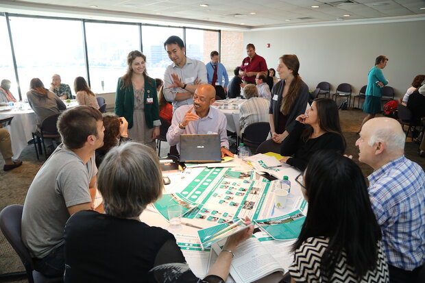 Figure 3: At the Boston Museum of Science, members of the public discuss ways to reduce their vulnerability to climate hazards. This project is funded by NOAA Education and is the first of 8 planned forums. Credit: Eric Workman